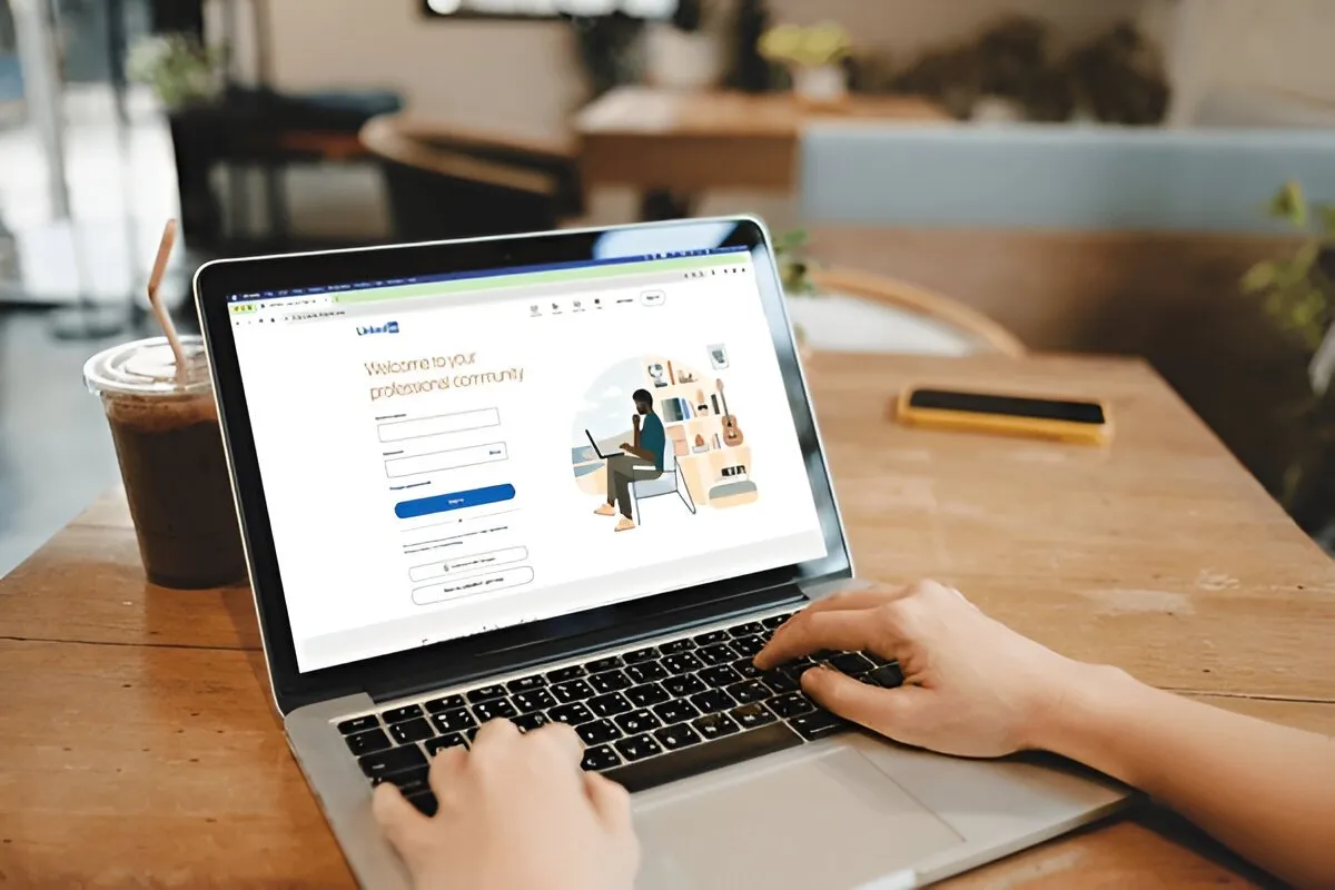 How to Reply to a Recruiter on LinkedIn LinkedIn user replying to a recruiter message on their laptop